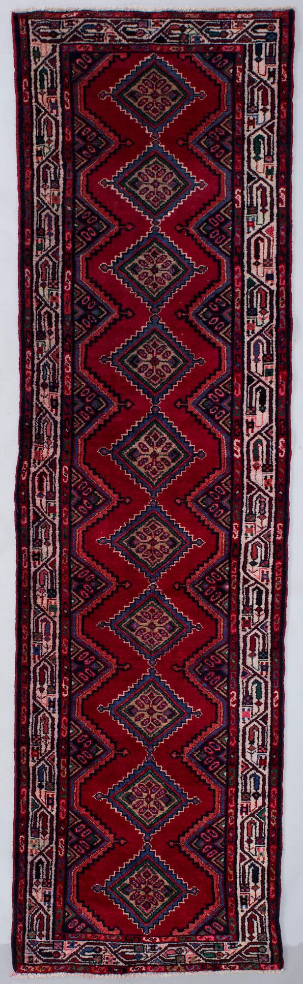 An Zageh rug, 294 x 83 cm.