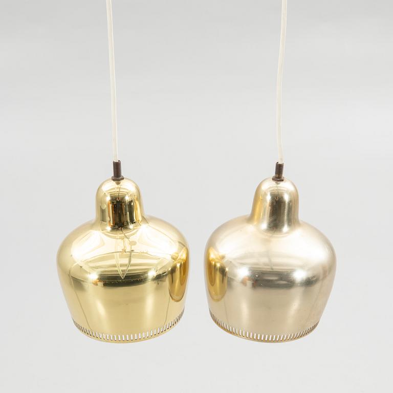 Alvar Aalto, a pair of "Golden Bell" brass pendant lamps, for Artek, Finland, model "A330S".