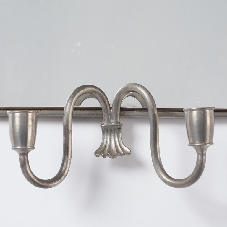 Estrid Ericson, a pewter and brass wall scone for two candles, Svenskt Tenn, Stockholm 1934.