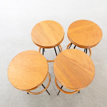 A set of four mid 20th century bar stools.