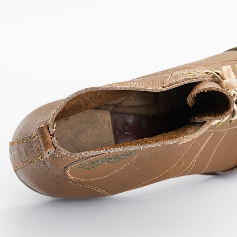 A pair of Olympic football shoes, labelled Karhu. Finland, 1940s.