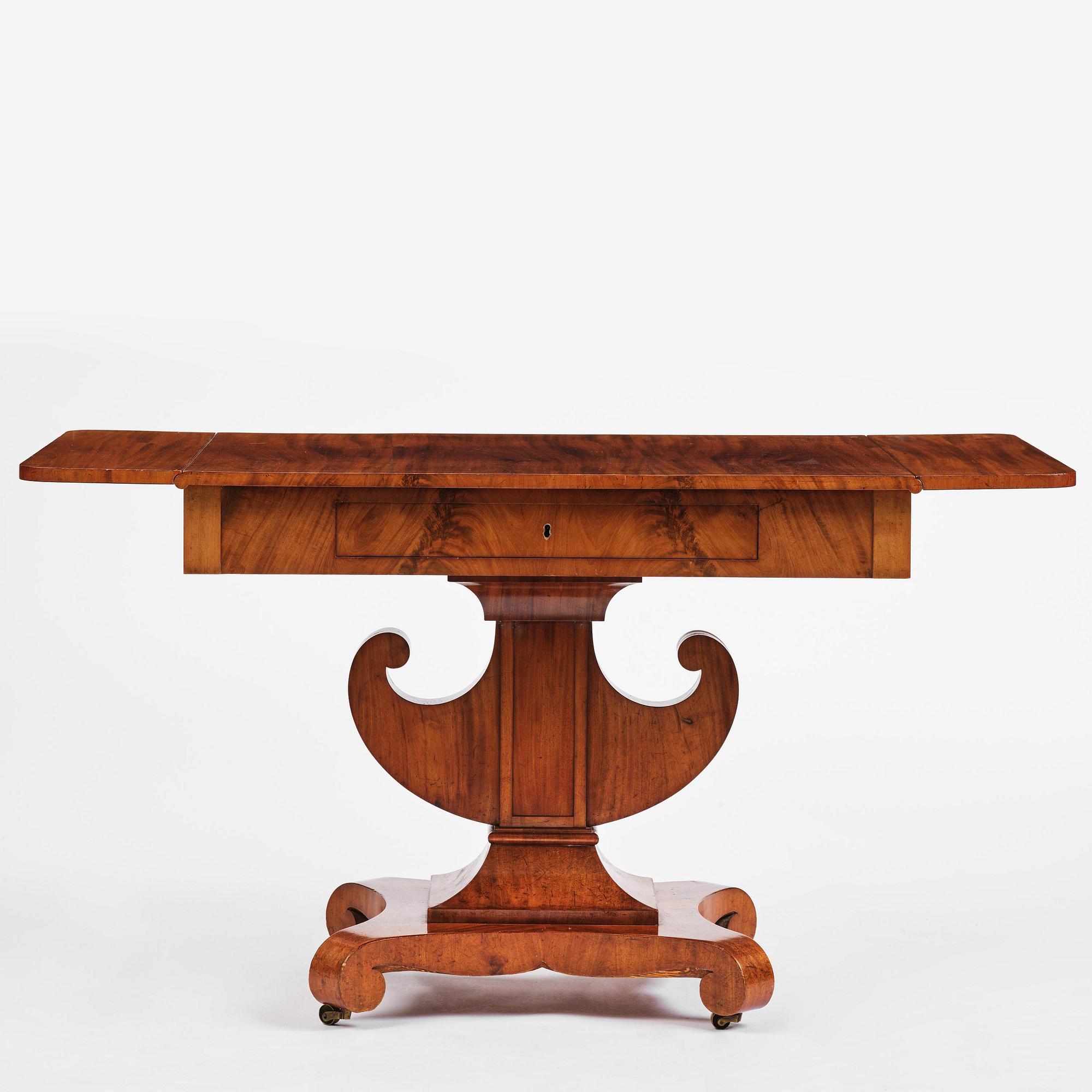 A Swedish Empire mahogany center table.
