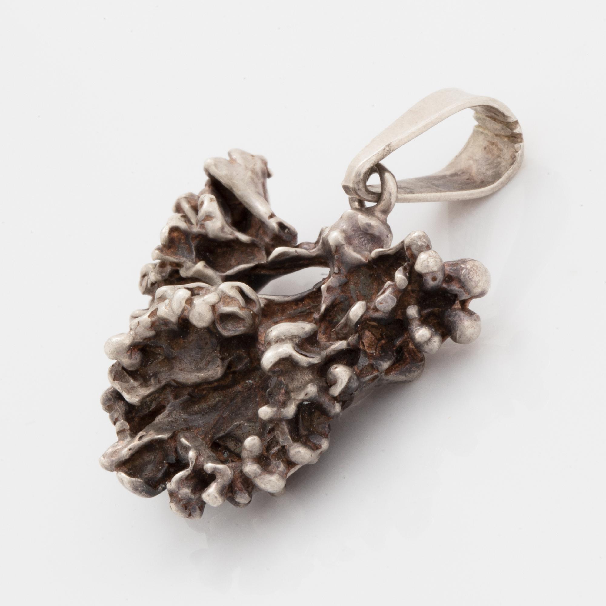Five pendants and one brooch, silver.