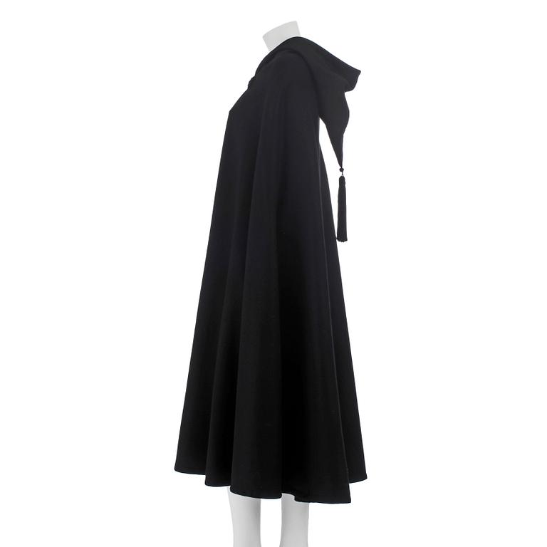 YVES SAINT LAURENT, a black wool cape with hood. .
