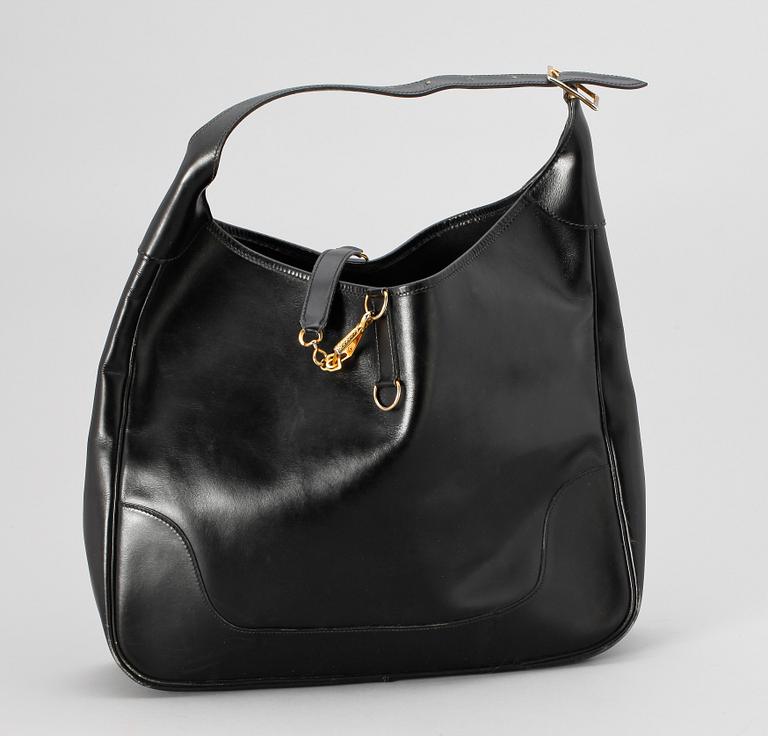 A 1970s black leather handbag by Hermès, model "Trim bag".