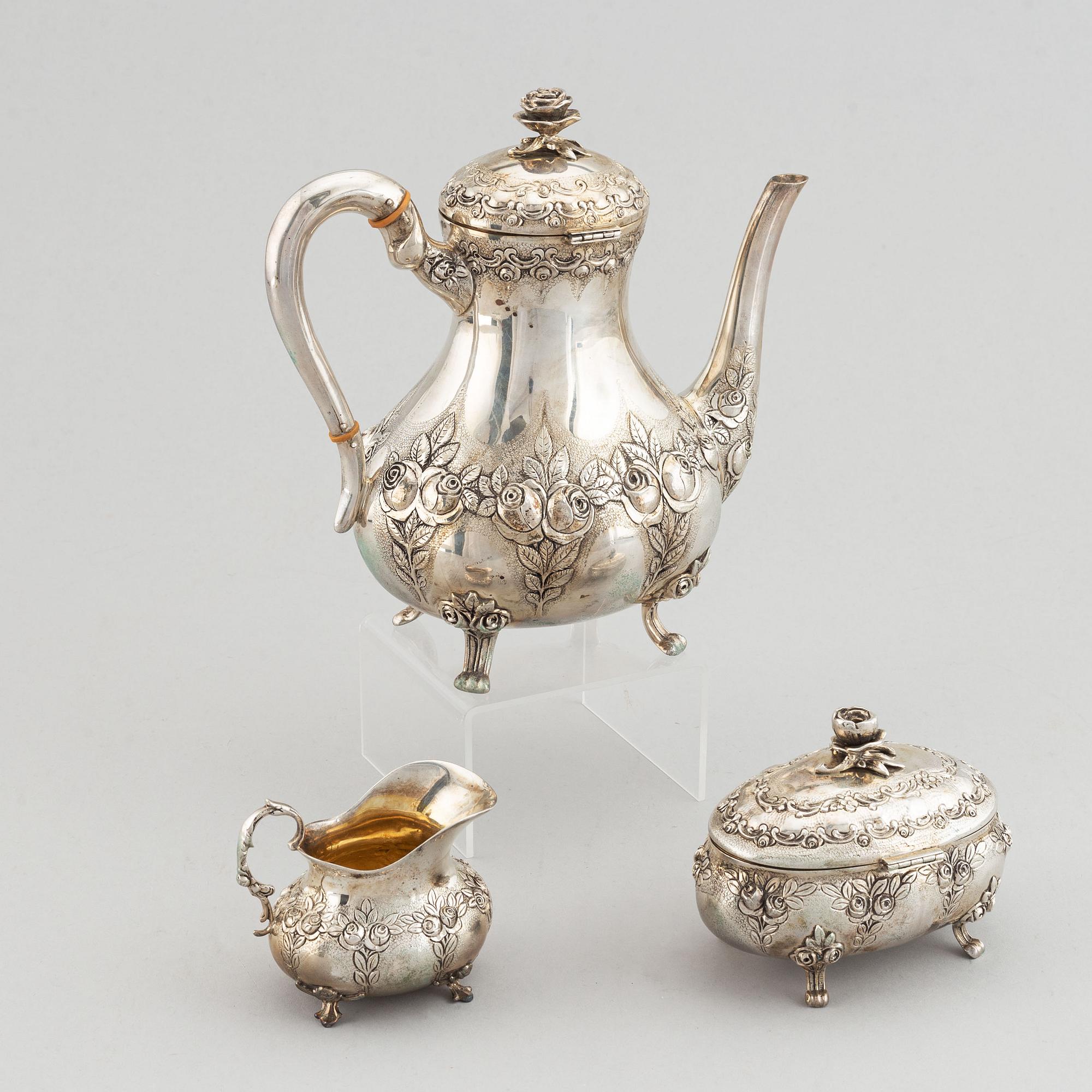 A rococo-style coffee pot, creamer and sugar bowl, swedish import mark, 20th century.