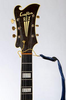 A Crafton Rex acoustic guitar.