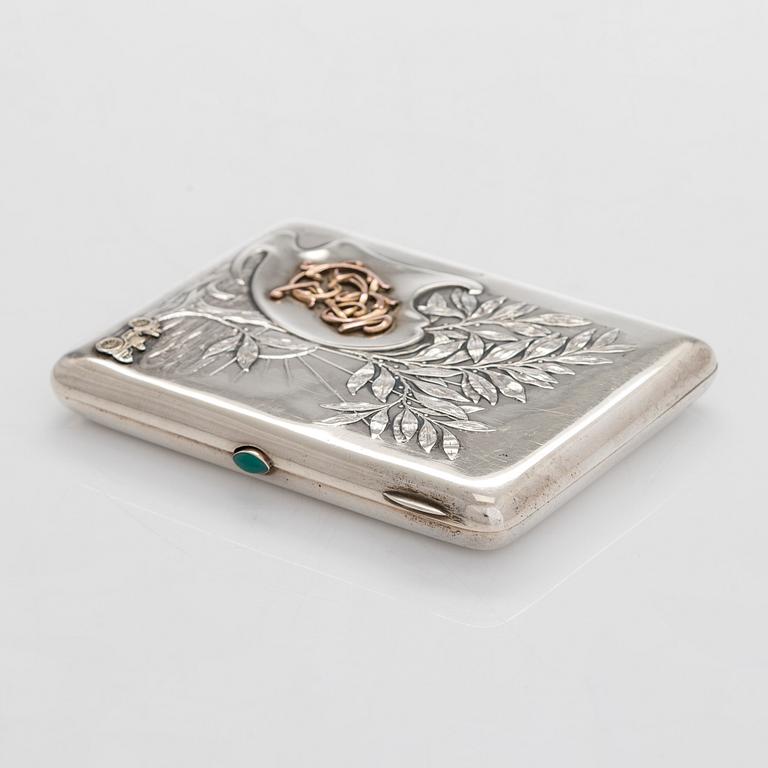 A silver cigarette case, Moscow, dated 1916.
