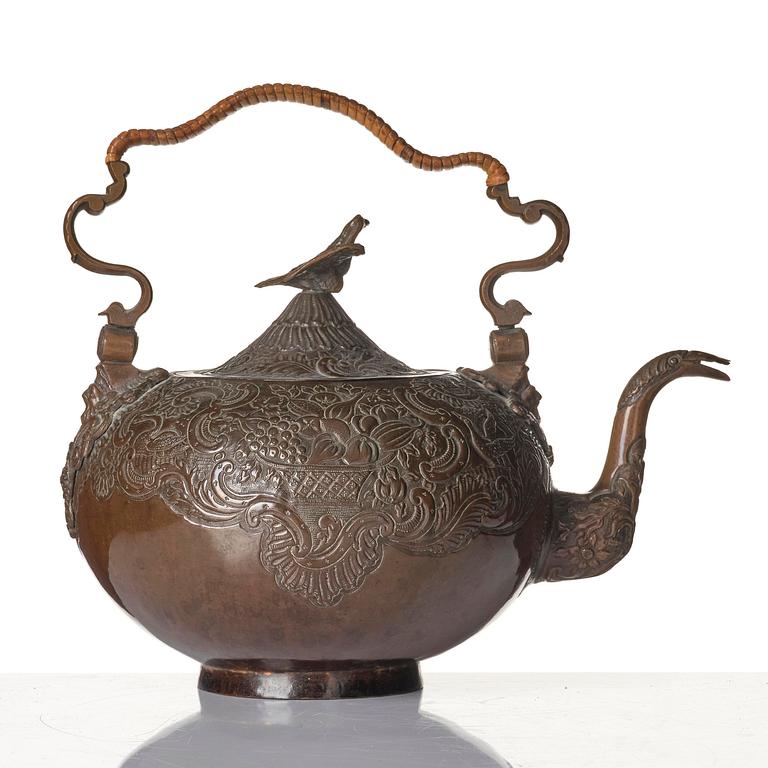 A German Rococo repoussé copper teapot, mid 18th century.