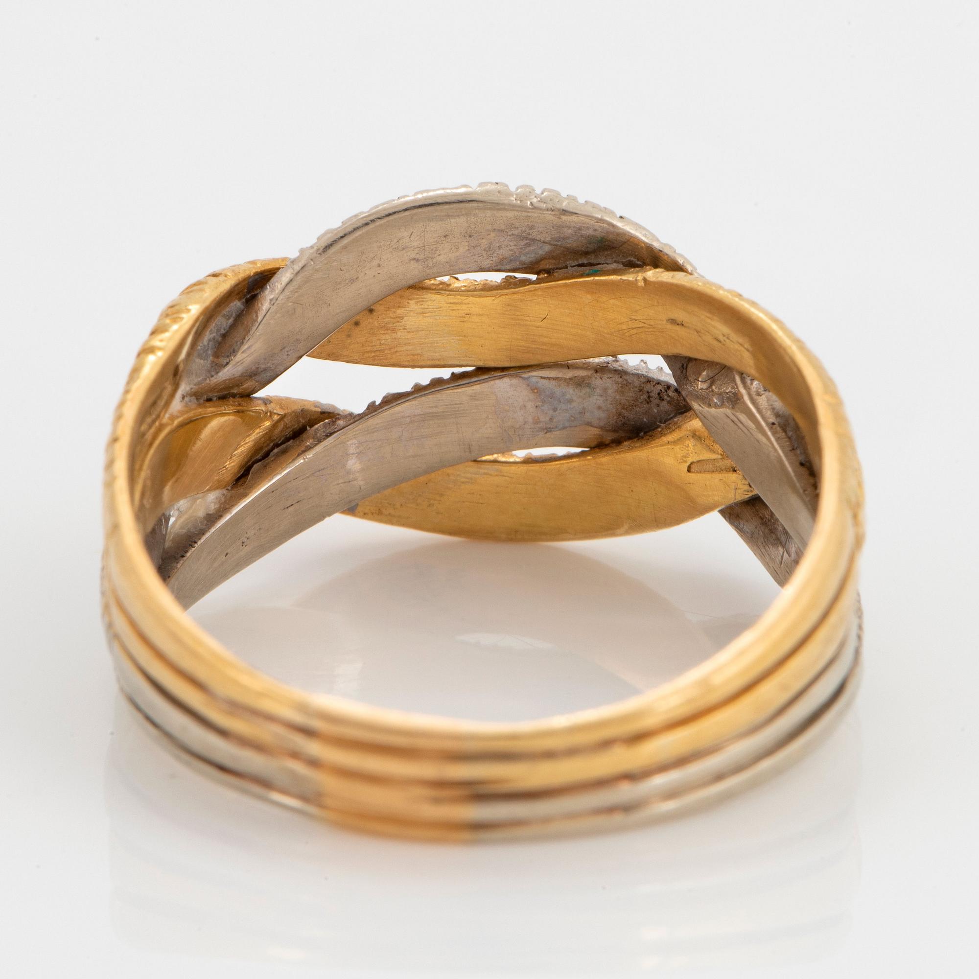 An 18K gold and white gold ring.