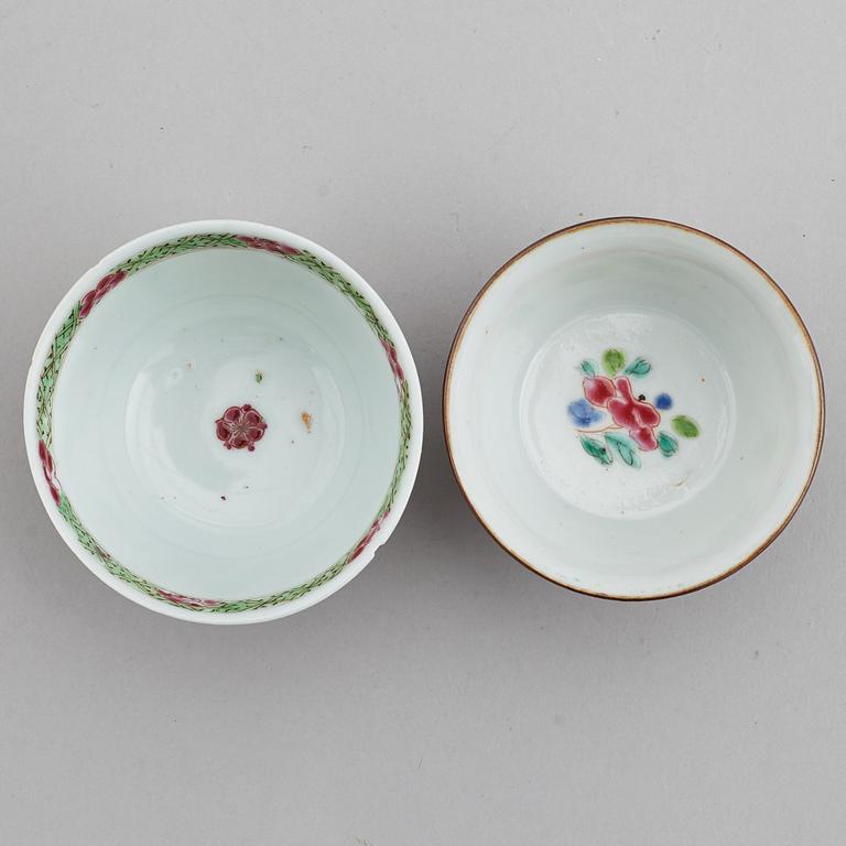 A famille rose butter tureen with cover and two cups with three odd stands, Qing dynasty, Qianlong (1736-95).