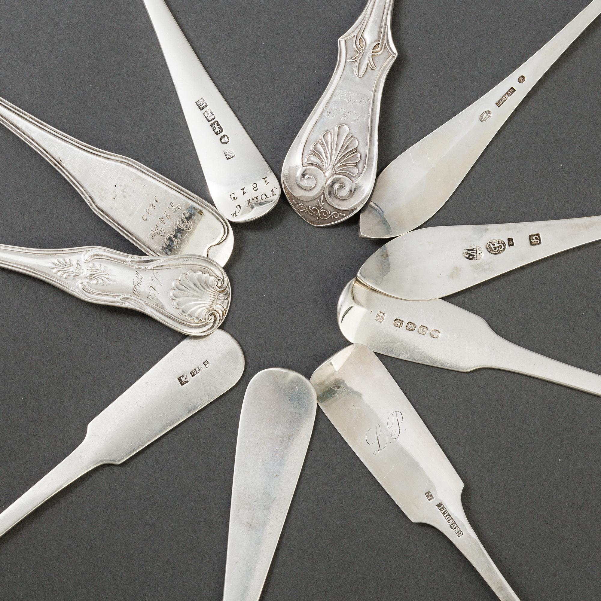 A set of 10 different spoons of different nationalities.