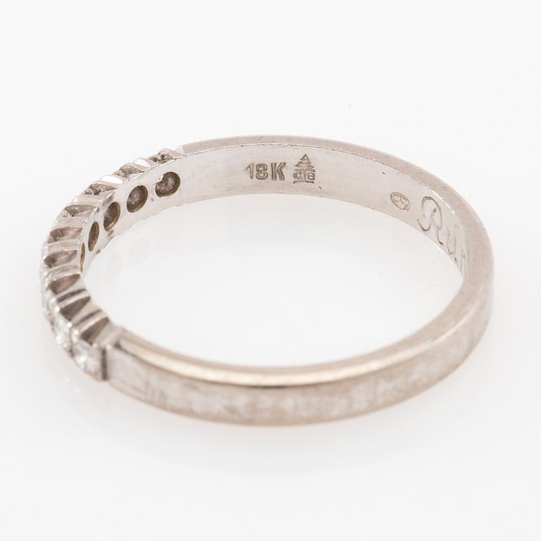 Ring with a half eternity band in 18K white gold set with round brilliant-cut diamonds.