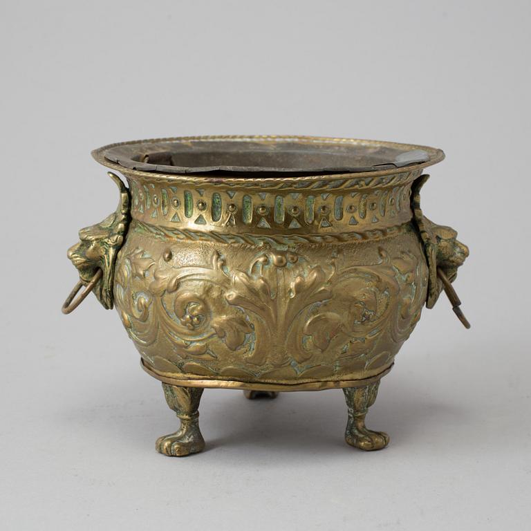 A 19TH CENTURY BRASS FLOWER POT.