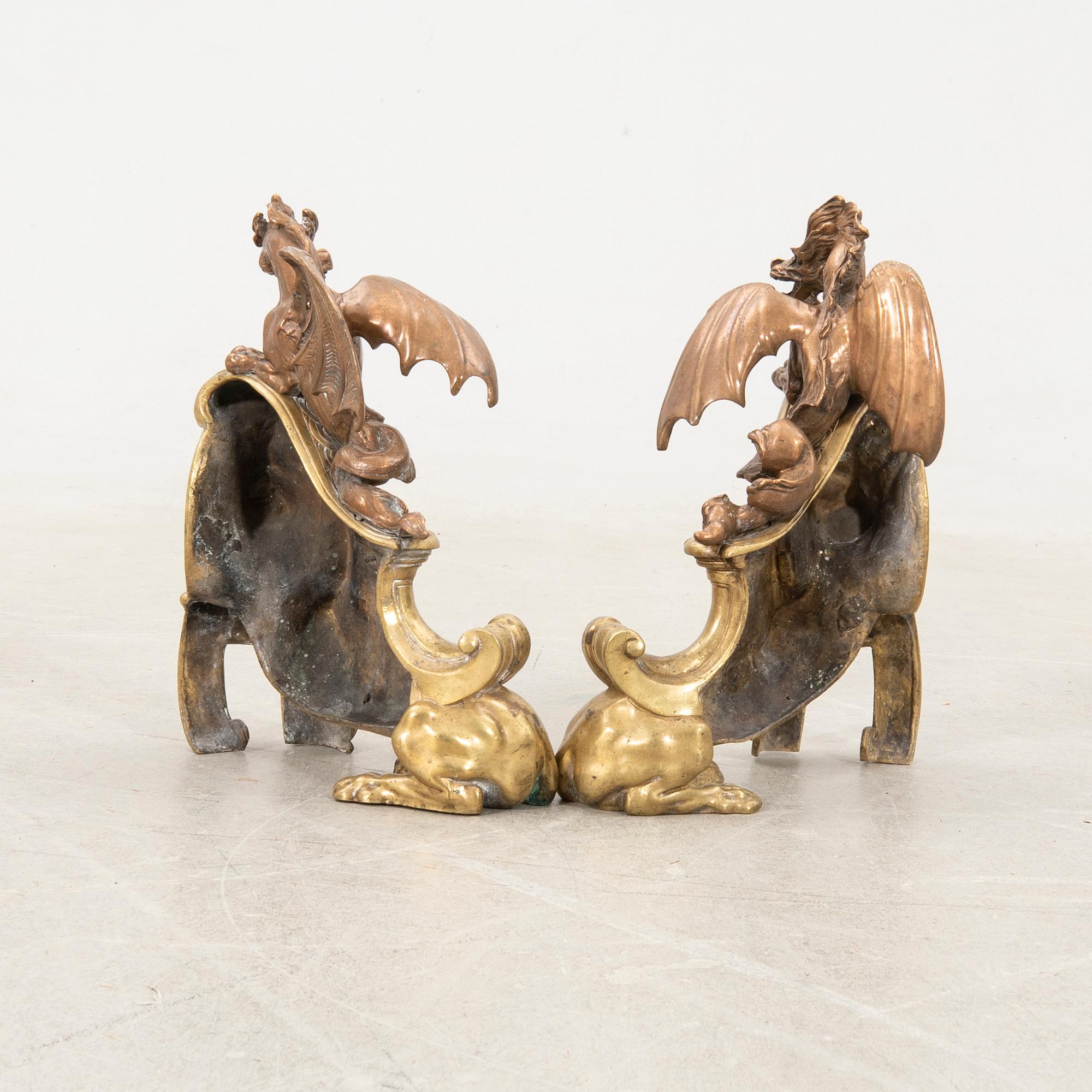 Fire dogs a pair of Baroque style 20th century in the manner of Charles Cressent.