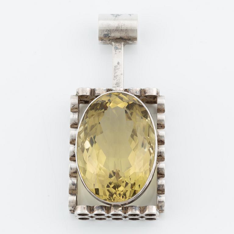 Cecilia Johansson, pendant, silver with yellow/green stone likely quartz.