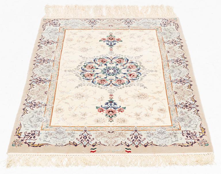 A part silk Isfahan rug, signed, c. 125 x 84 cm.