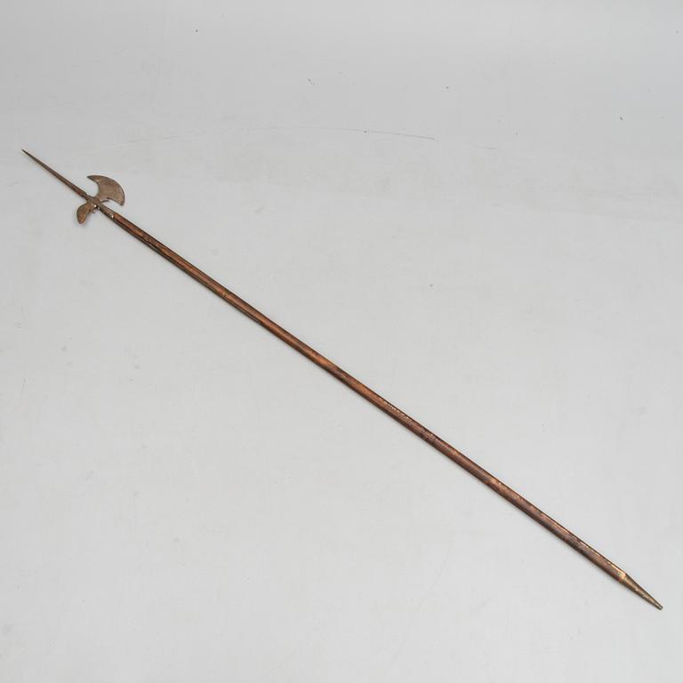 An 20th Century wood and iron halberd.