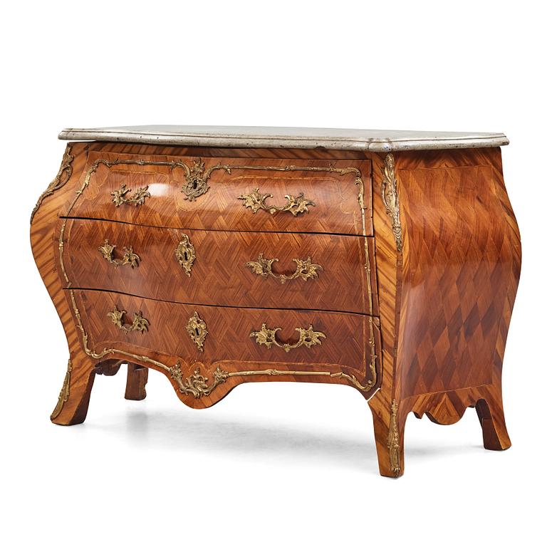 A rococo rosewood-veneered and ormolu-mounted commode by N. Korp (master 1763-1800).