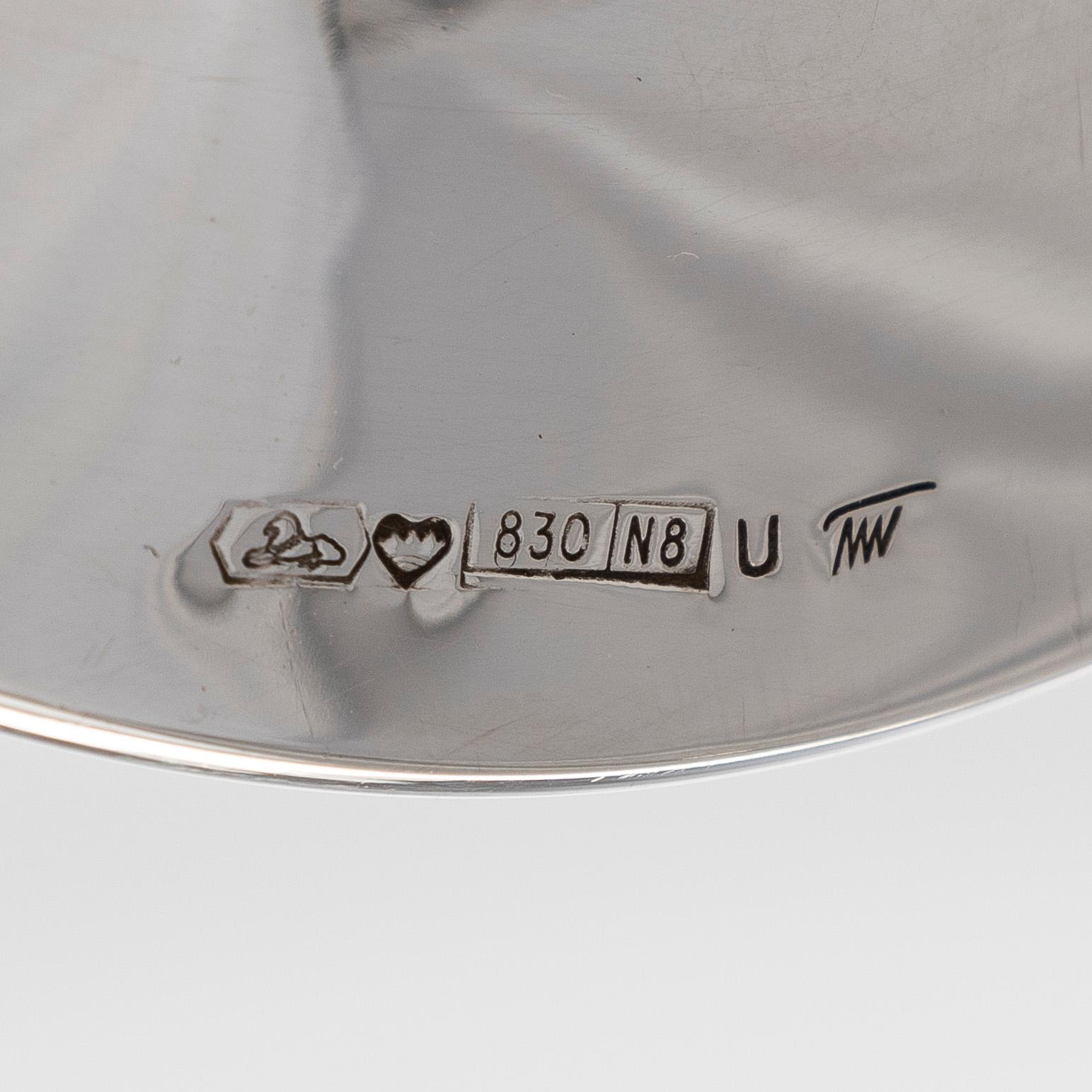 Tapio Wirkkala, A set of four silver candlesticks, "Trumpetti", Kultakeskus, Hämeenlinna 1979 and 1990.