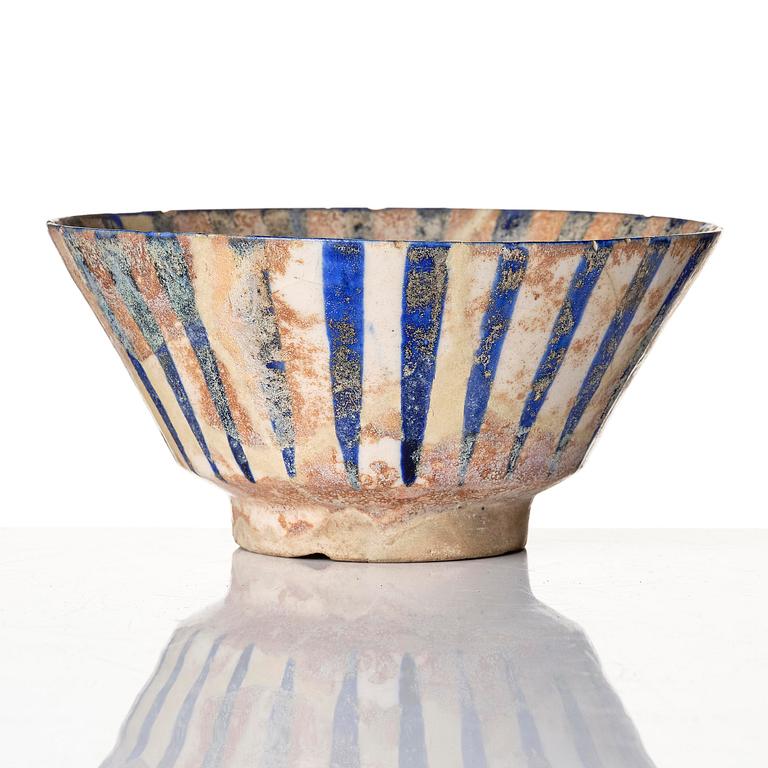 A cobalt glazed radila design pottery bowl, Persia (Iran), 12th/13th century.