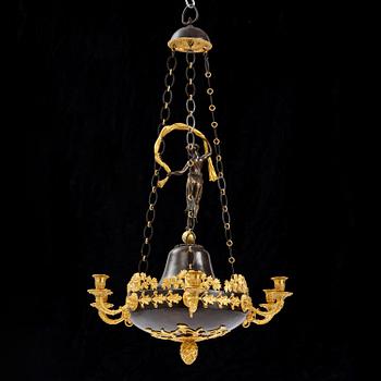 A patinated and ormolu six-light Empire chandelier, Stockholm, first part 19th century.