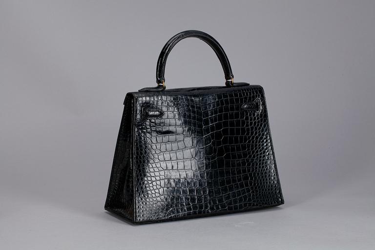 A 1960s/70s black alligator "Kelly" handbag by Hermès.