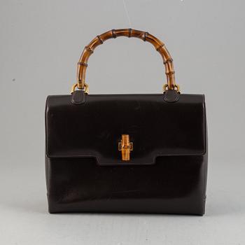 Gucci, a leather and bamboo bag.