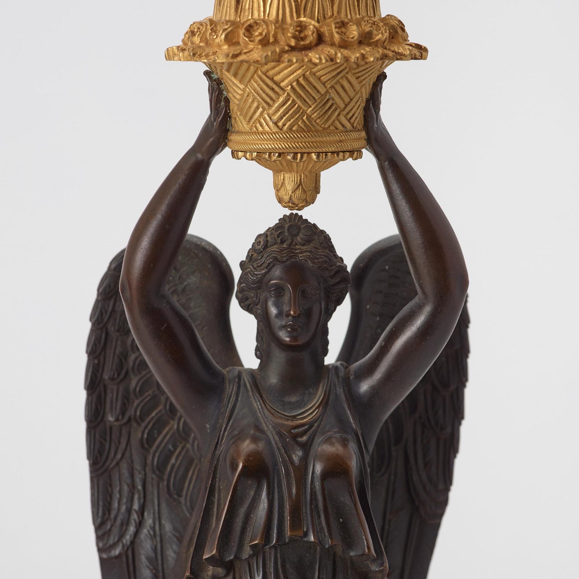 A pair of Empire early 19th century five-light candelabra by Pierre Chibout.