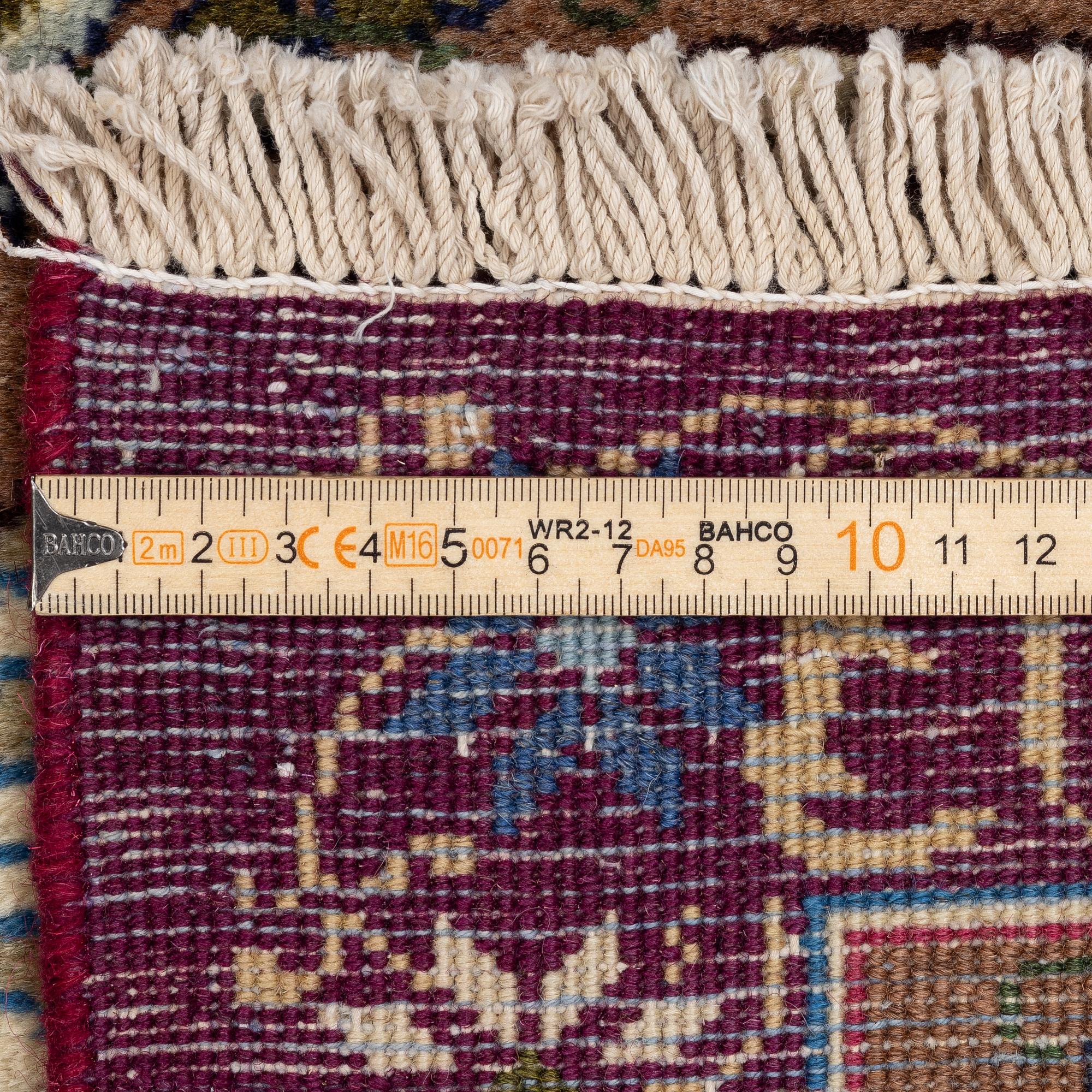 A Kashmar carpet, c. 347 x 242 cm.