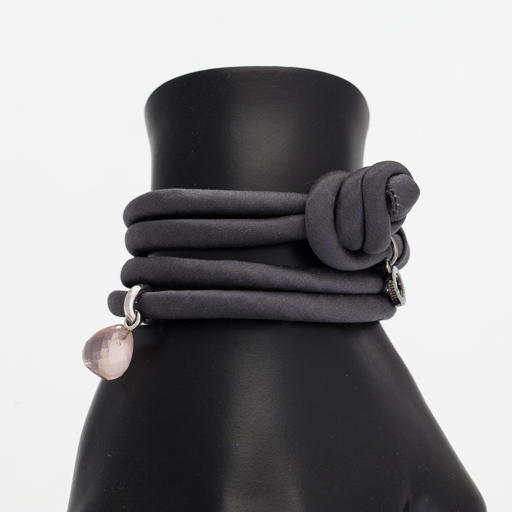 Ole Lynggaard, A silk, rose quartz, diamond 0.015 ct and 18K white gold bracelet. Denmark.