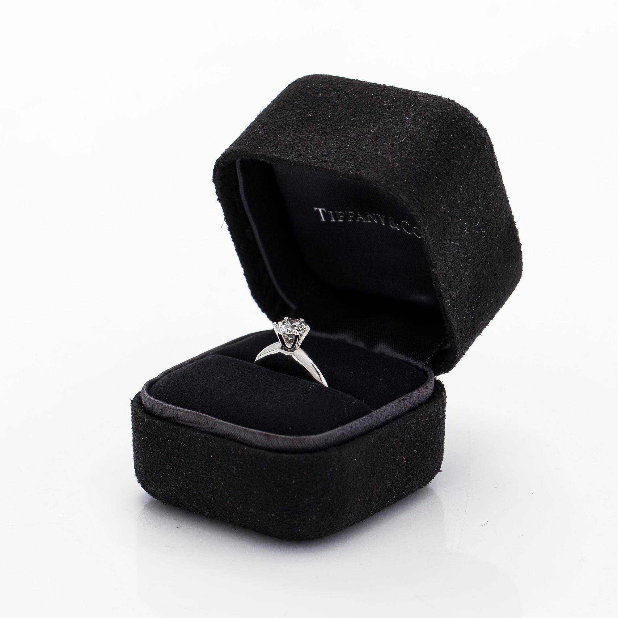 Tiffany & Co, a platinu solitaire ring with a brilliant-cut diamond.