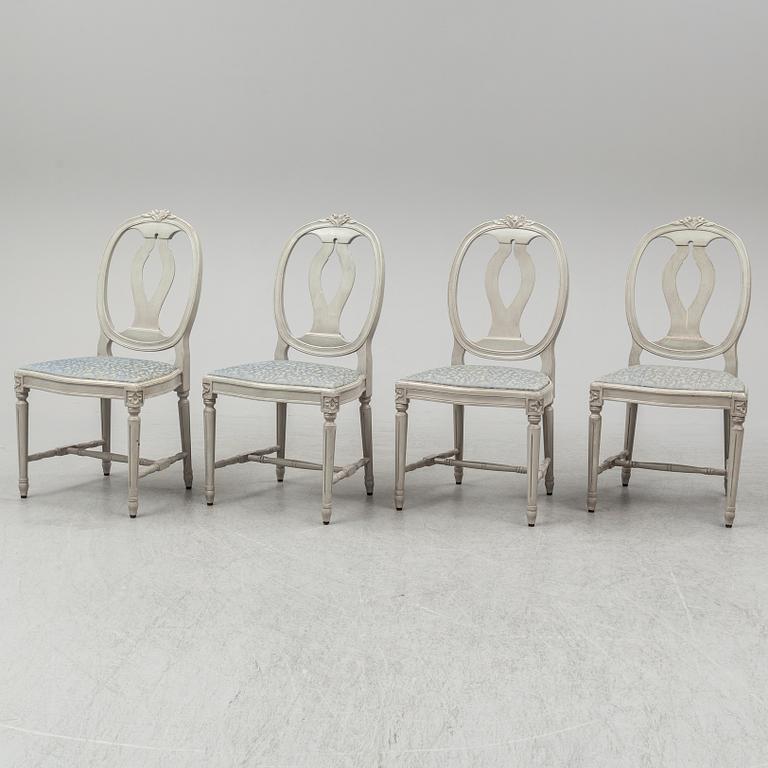 A dining table and four chairs, gustavian style, late 20th century.