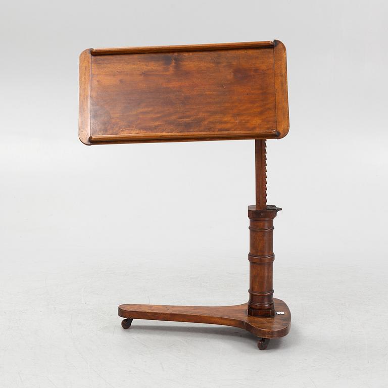 A reading table, J. Carter London, England, circa 1900.