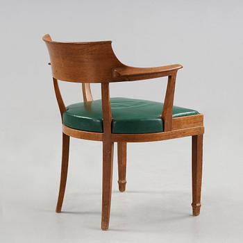 Alfred Grenander, a mahogany and green leather armchair, ca 1905.