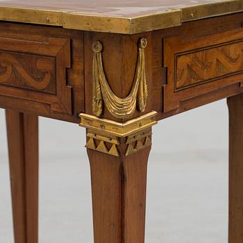 A Louis XVI-style circa 1900 occasional table.