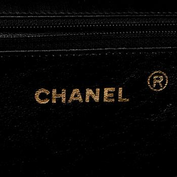 CHANEL, a black patent leather flap bag.