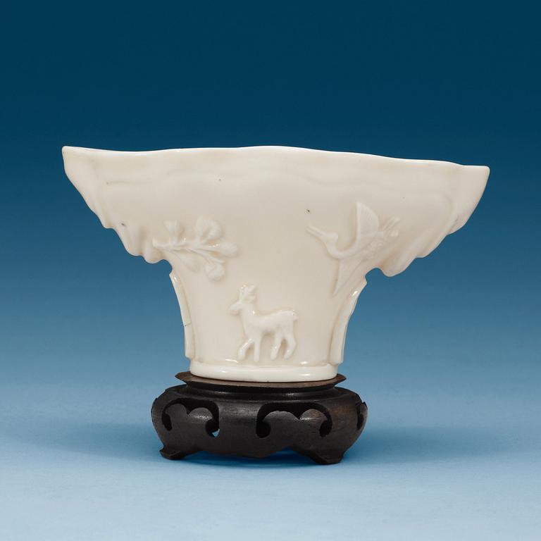 A blanc de chine libation cup, Qing dynasty.