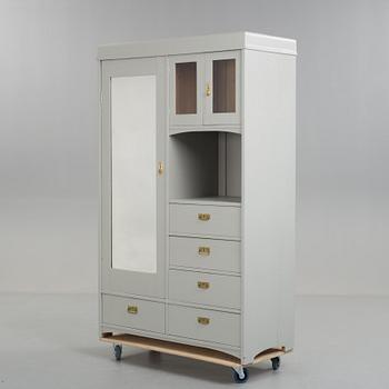 A early 20th century cabinet with mirror.