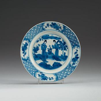 A set of four odd blue and white dinner plates, Qing dynasty, Kangxi (1662-1722), with different six character marks.