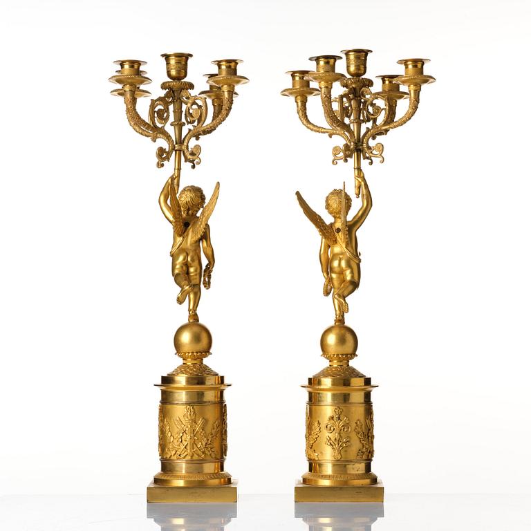 A pair of Empire five lights candelabra.