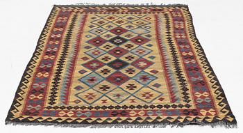 A Kelim rug, c. 250 x 142 cm.