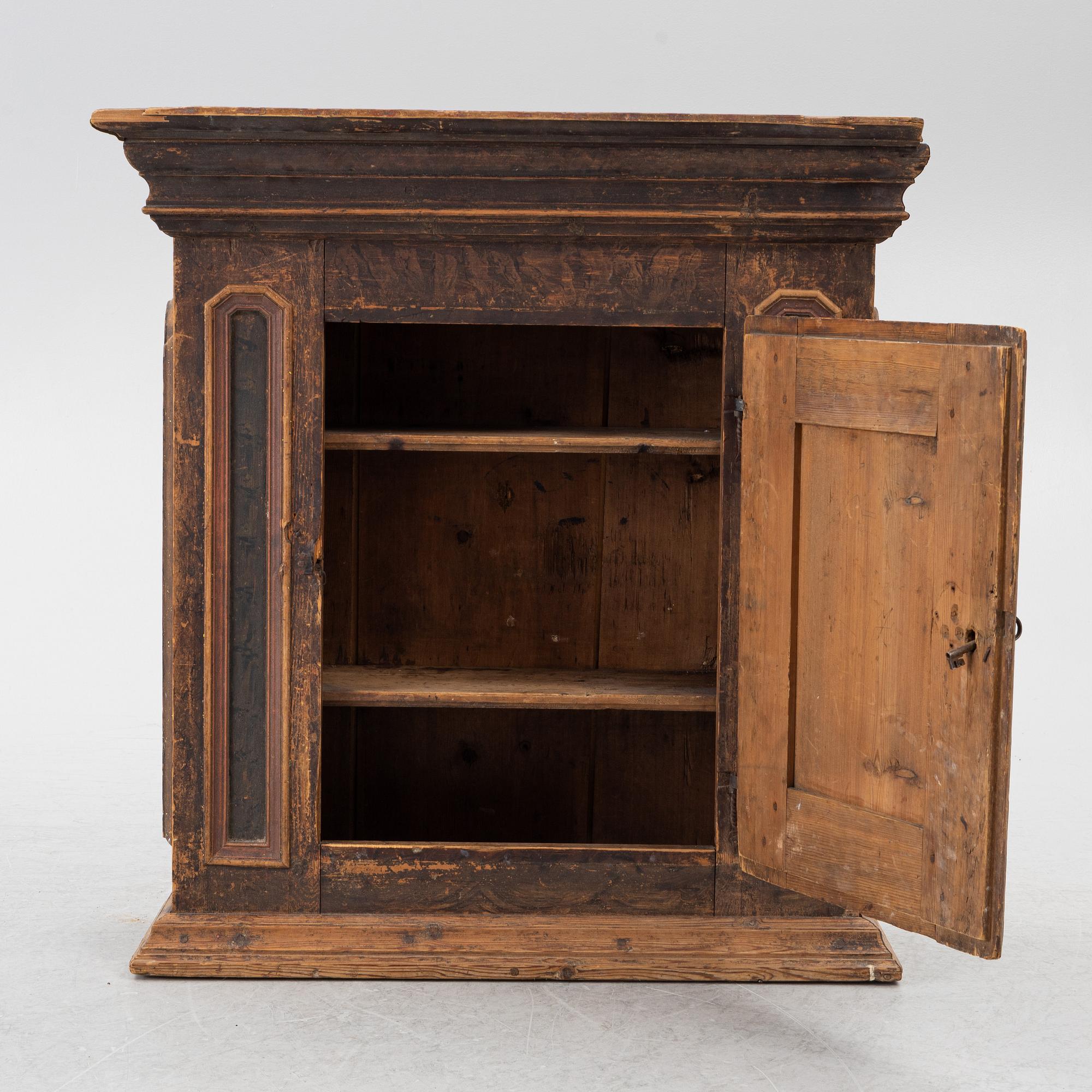 A polychrome-painted folk art hanging cabinet from Järvsö, Sweden, early 19th century.