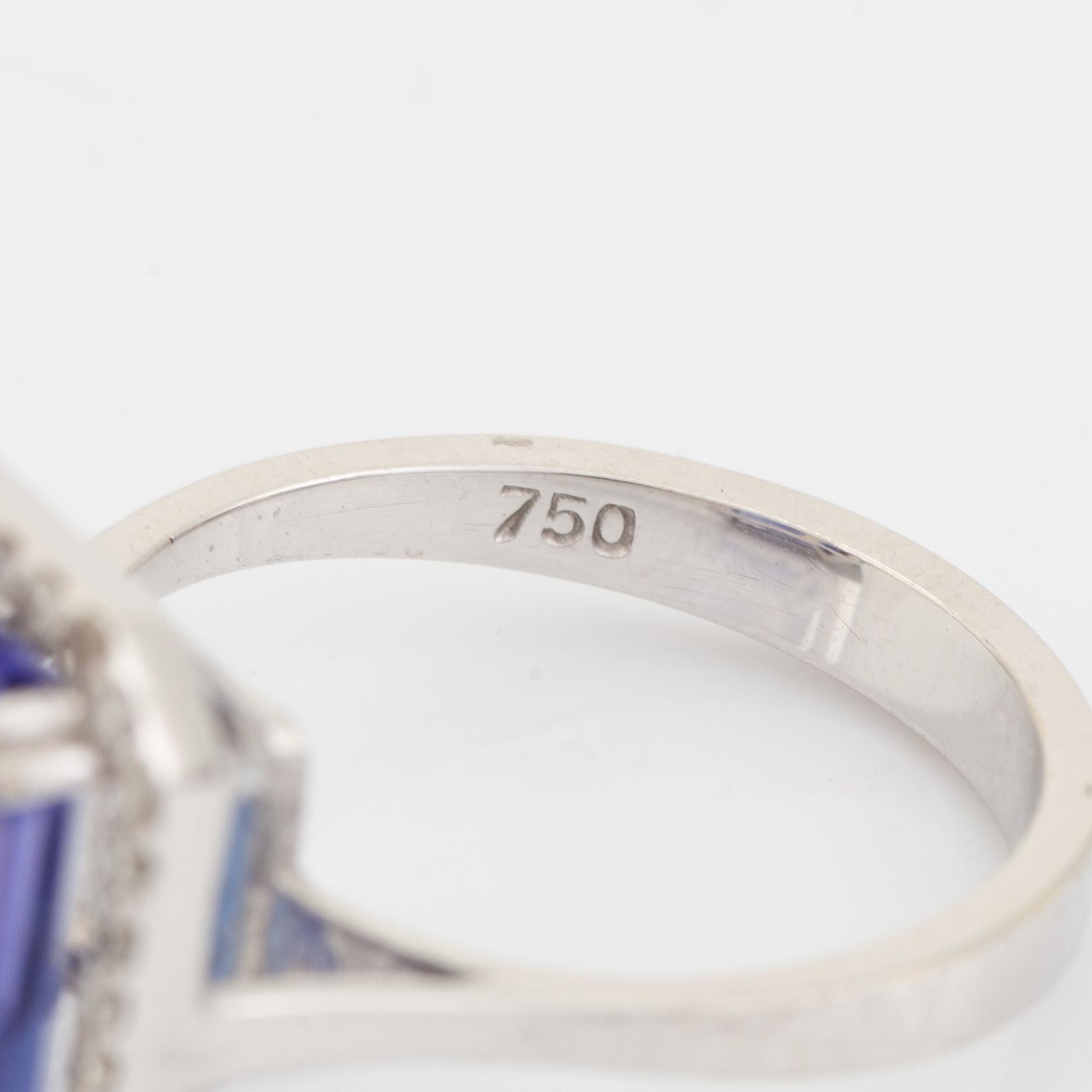 Emerald cut tanzanite and brilliant cut diamond cocktail ring.