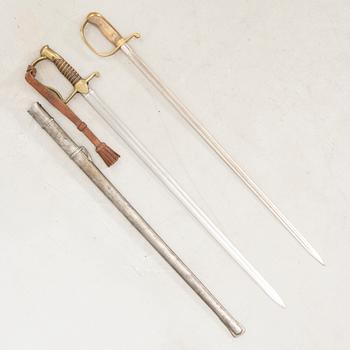 A Swedish sabre 1899 pattern with scabbard with another sword.