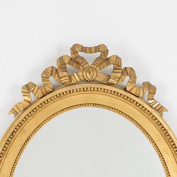 A gustavian style mirror, beginning of the 20th century.
