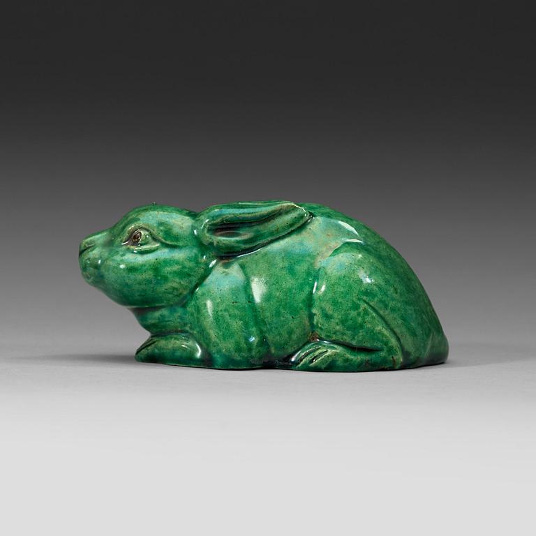 A green glazed figurine, Qing dynasty (1644-1912).