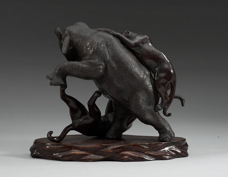 A Japanese bronze figure of tigers attacking an elephant, ca 1900.