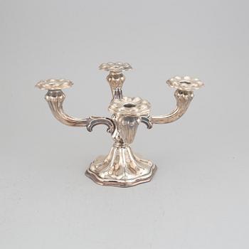 CG Hallberg, kandelaber samt ett par ljusstakar, silver, rokokostil, Stockholm, 1936 och 1935.