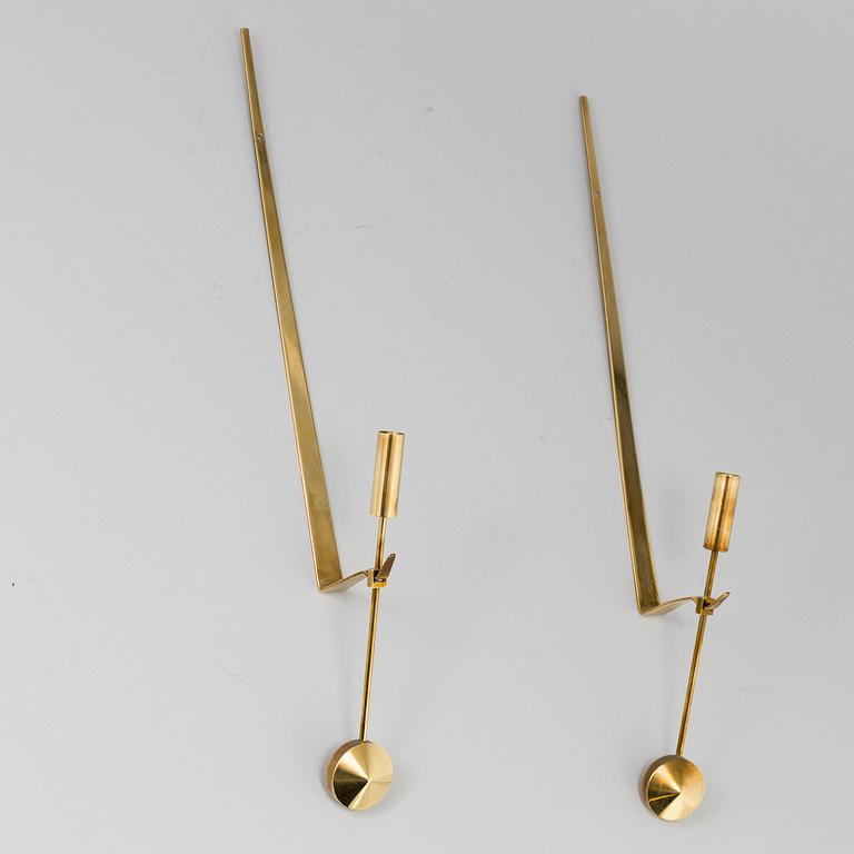 A pair of brass wall candle holders by Pierre Forsell, Skultuna.